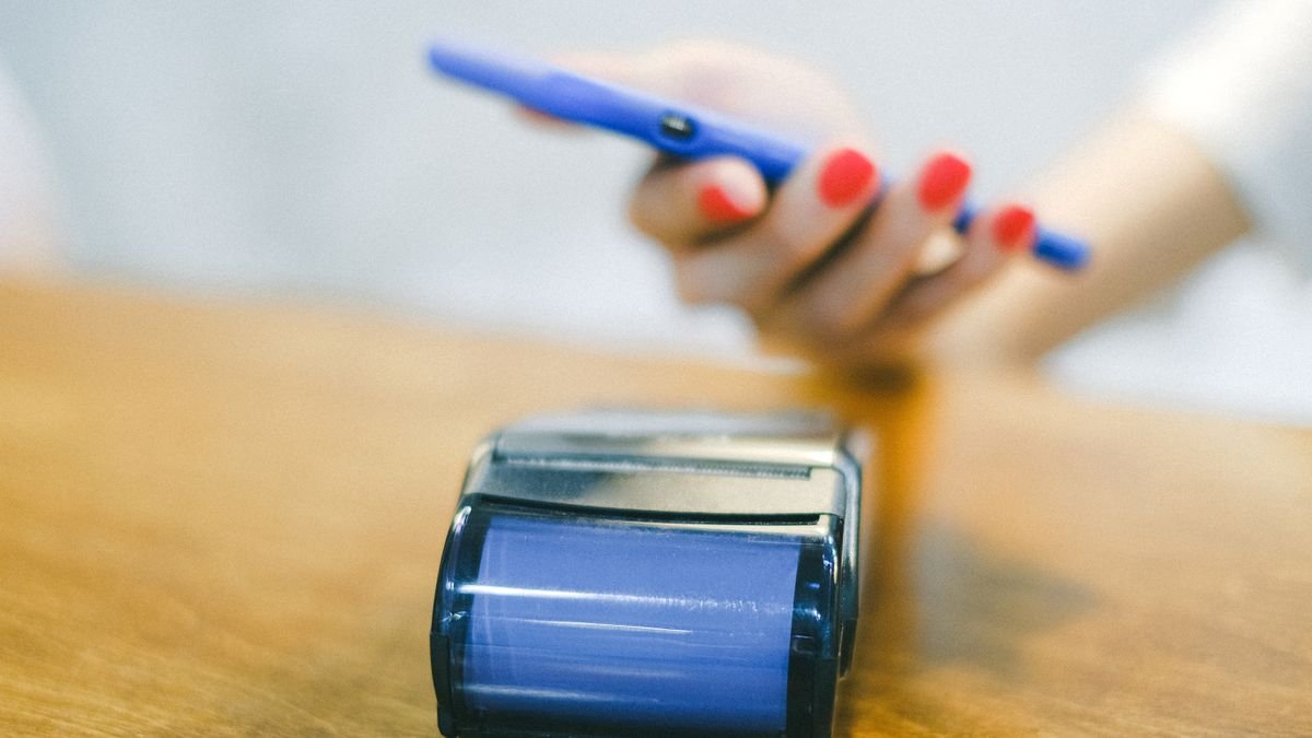 Close-up of a phone being used to pay contactless
