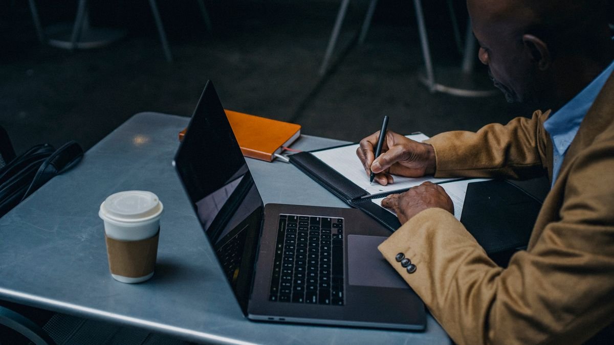 Freelancer working on a laptop at a table
